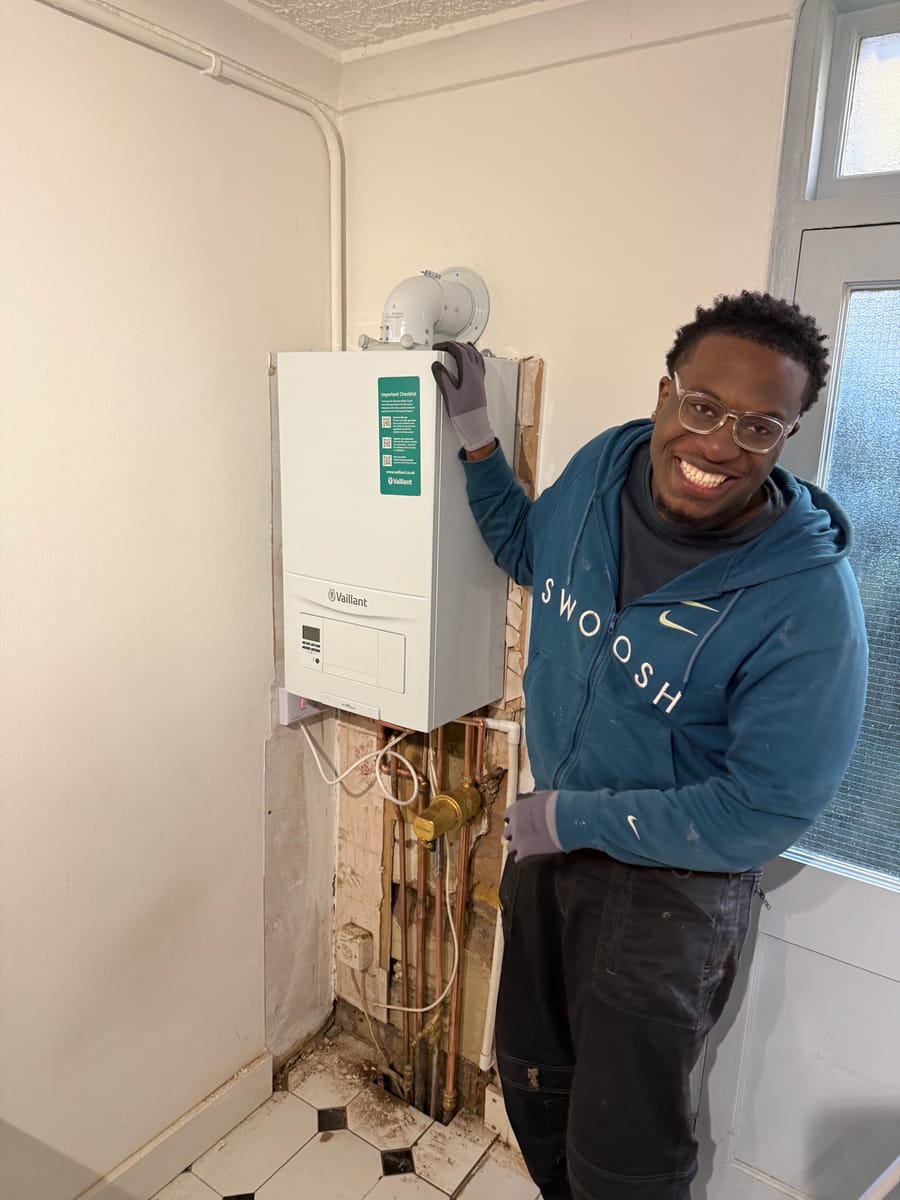 Future Home Energy engineer beside a completed Vaillant boiler installation