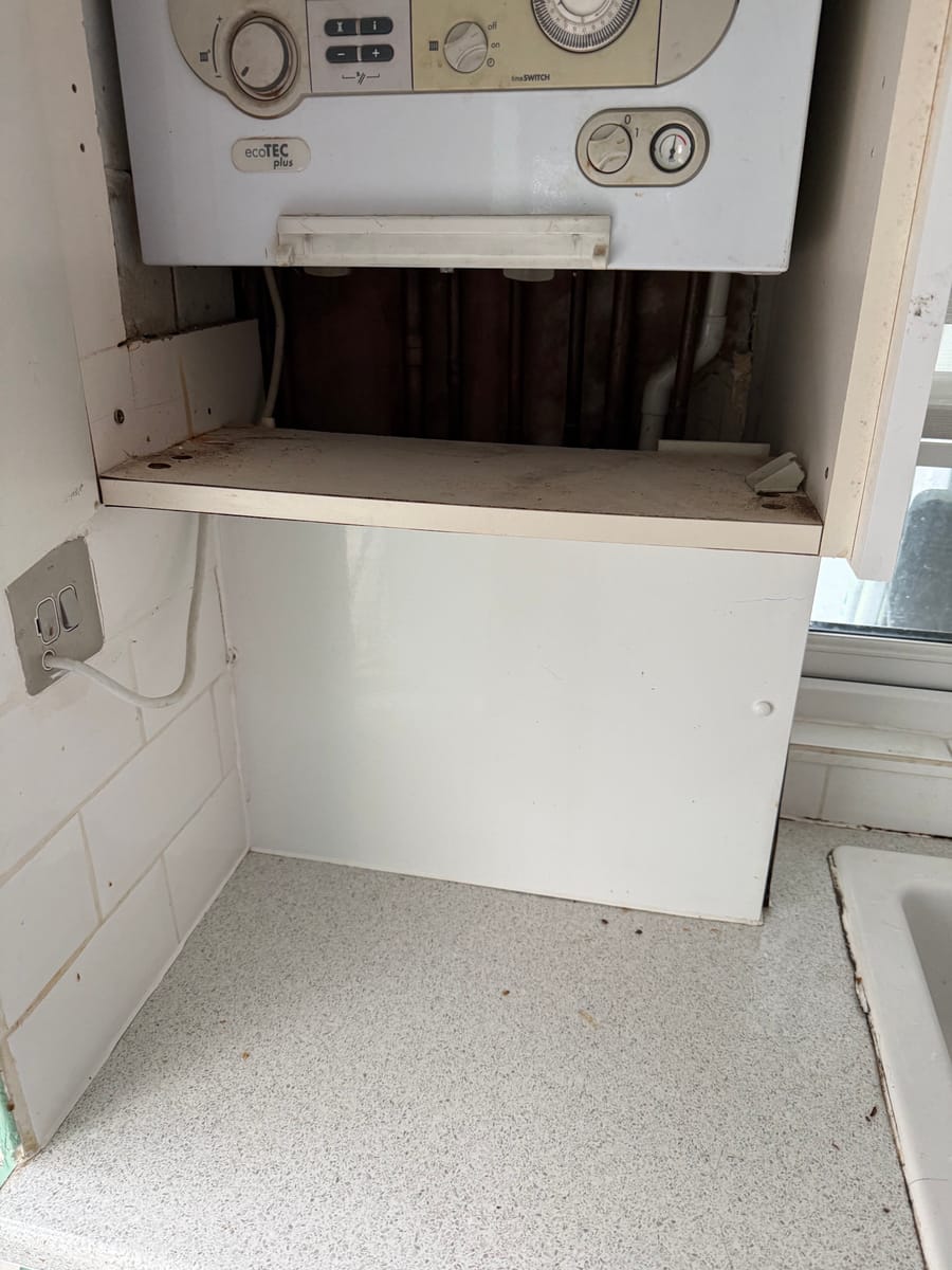 Cupboard cleared after an old boiler was removed